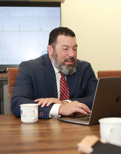 Attorney Daniel E. Collins sitting at a table